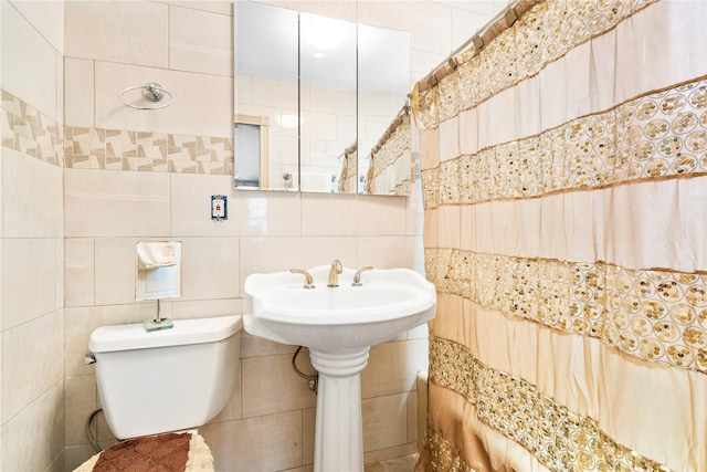 142 Primrose Ave, Mount Vernon, NY 10552 - bathroom featuring toilet, tile walls, and a sink