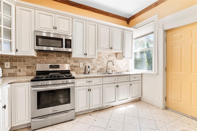 142 Primrose Ave, Mount Vernon, NY 10552 - kitchen with crown molding, a sink, backsplash, and stainless steel appliances