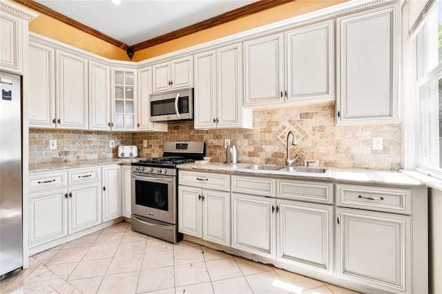 142 Primrose Ave, Mount Vernon, NY 10552 - kitchen featuring a sink, decorative backsplash, light stone countertops, and stainless steel appliances