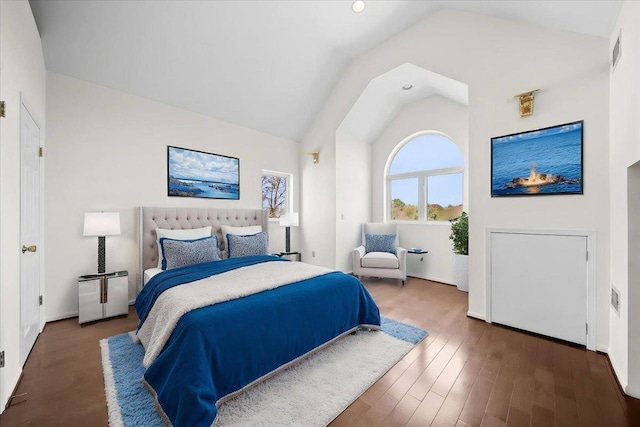bedroom with recessed lighting, vaulted ceiling, wood finished floors, and visible vents