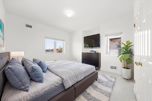 bedroom featuring visible vents and carpet flooring