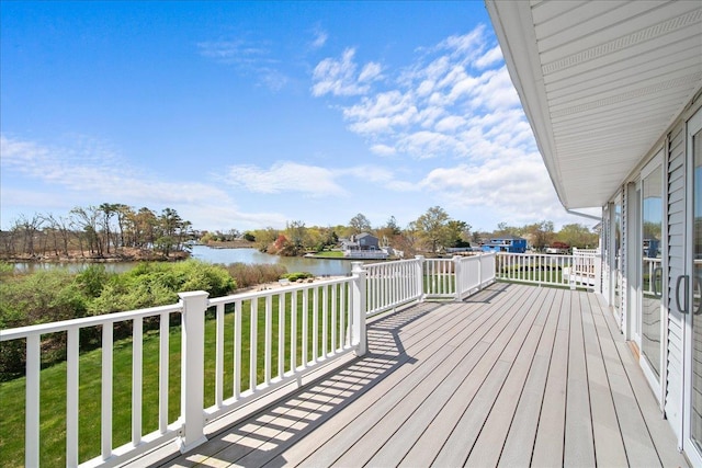 deck featuring a water view and a yard