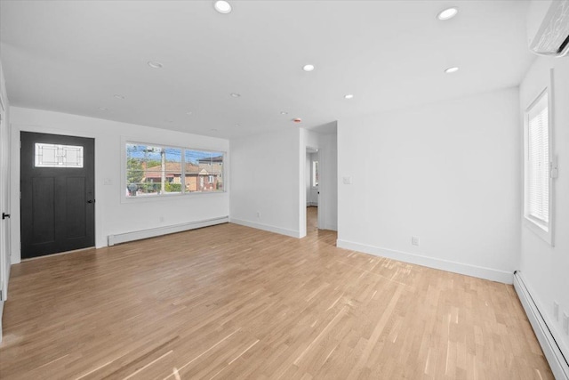 unfurnished living room featuring baseboard heating, recessed lighting, and a wall mounted air conditioner