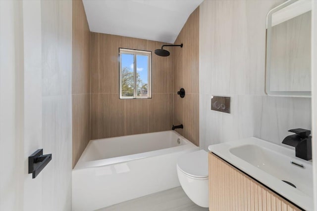 full bathroom featuring toilet, bathing tub / shower combination, and vanity