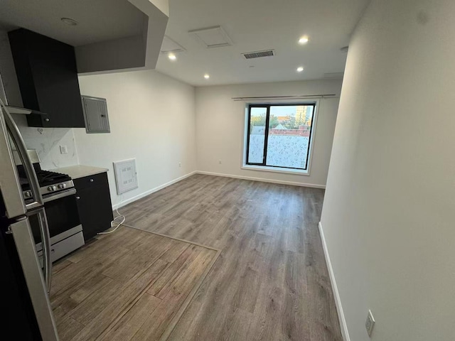 42-08 Bowne St Unit 2A, Flushing, NY 11355 - kitchen featuring dark cabinets, stainless steel gas range, wood finished floors, and visible vents