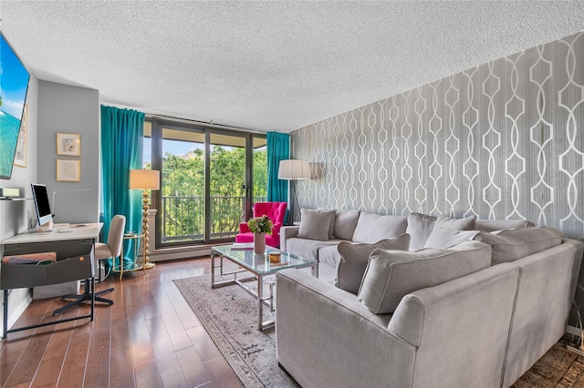 living room featuring a textured ceiling and wood finished floors