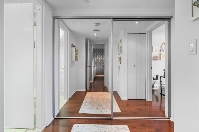 hall featuring wood finished floors