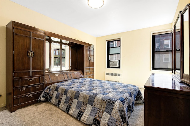 bedroom featuring radiator heating unit, light carpet, and cooling unit