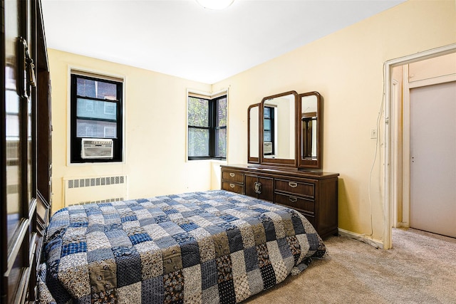 carpeted bedroom with baseboards and radiator heating unit