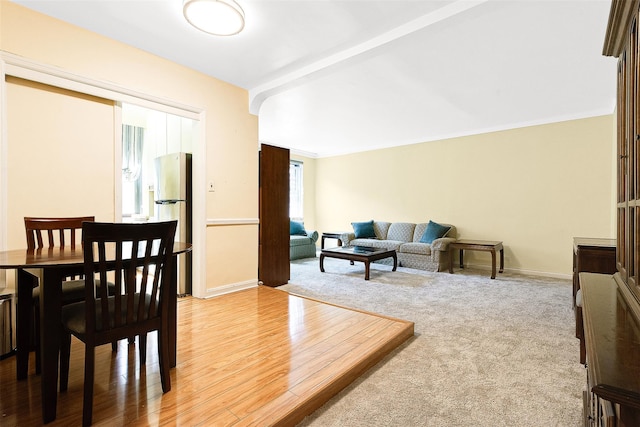 carpeted living room with baseboards