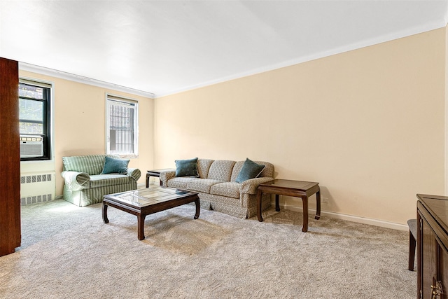 living room featuring carpet flooring, crown molding, baseboards, and radiator
