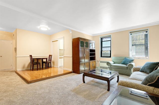carpeted living room featuring ornamental molding