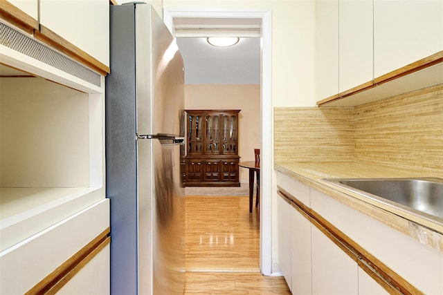hallway featuring light wood finished floors