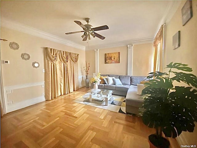 living room featuring crown molding, decorative columns, and ceiling fan