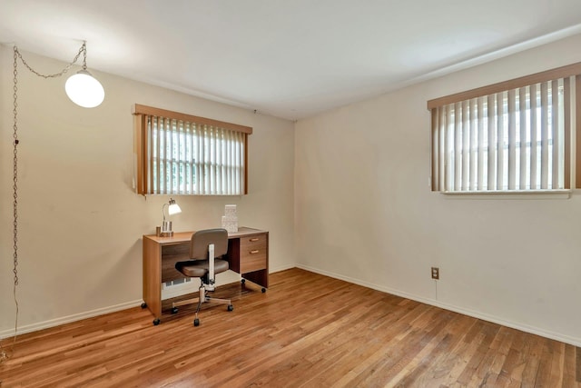 office with light wood finished floors and baseboards