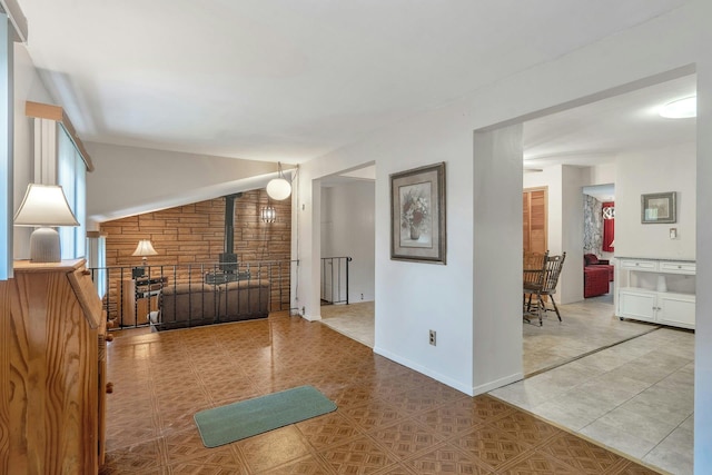 corridor with tile patterned flooring and baseboards
