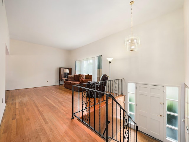 interior space with an inviting chandelier and wood finished floors