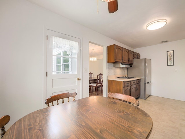 dining room featuring ceiling fan and visible vents