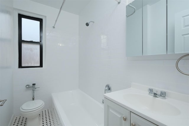 bathroom featuring tile walls, shower / bathtub combination, toilet, tile patterned floors, and vanity