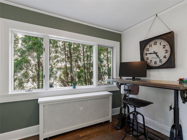 office area with crown molding, baseboards, dark wood-style floors, and radiator heating unit