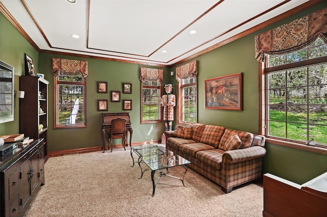 living room with crown molding, baseboards, carpet, and a healthy amount of sunlight