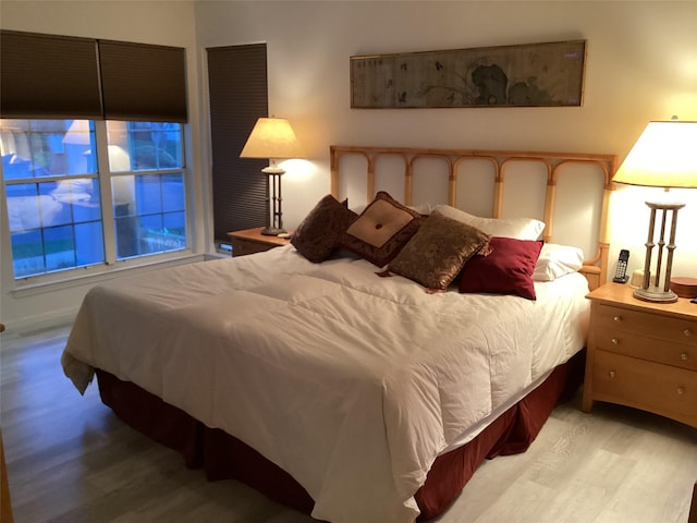 bedroom with wood finished floors