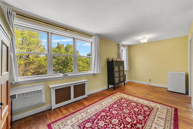 76 Dehaven Dr Unit 3D, Yonkers, NY 10703 - living area with wood finished floors, baseboards, and a wall unit AC