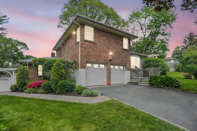 4 Sylvan Rd, White Plains, NY 10605 - view of property exterior featuring asphalt driveway, a garage, brick siding, and a lawn