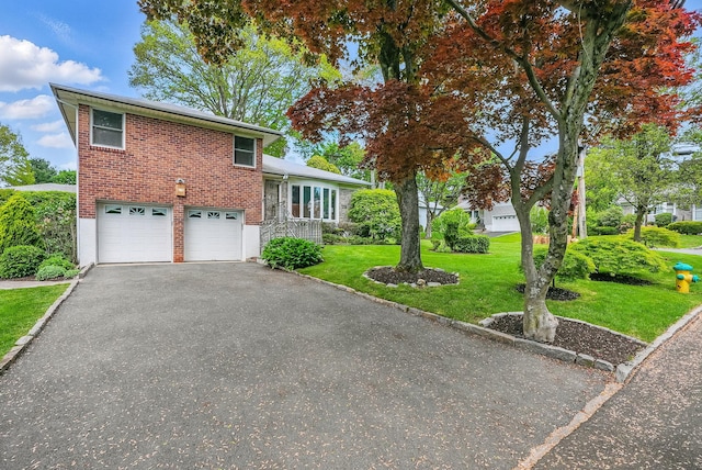 4 Sylvan Rd, White Plains, NY 10605 - split level home featuring a front lawn, brick siding, a garage, and asphalt driveway