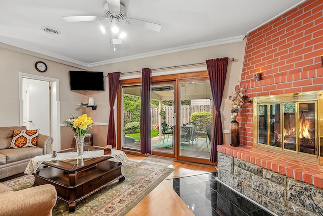 4 Sylvan Rd, White Plains, NY 10605 - living room featuring a ceiling fan, ornamental molding, a brick fireplace, and wood finished floors