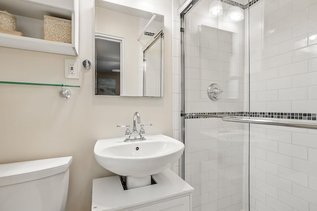 4 Sylvan Rd, White Plains, NY 10605 - bathroom featuring a shower stall, toilet, and a sink