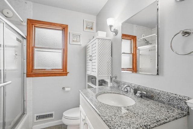 4 Sylvan Rd, White Plains, NY 10605 - bathroom featuring toilet, vanity, and combined bath / shower with glass door