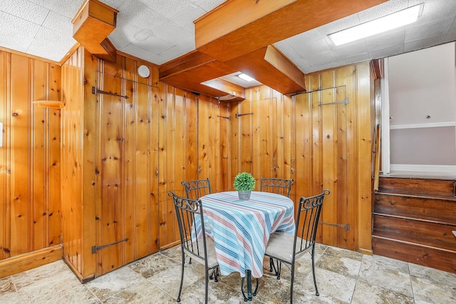 4 Sylvan Rd, White Plains, NY 10605 - dining space with wooden walls, a drop ceiling, and baseboards