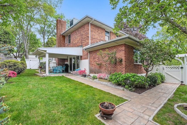 4 Sylvan Rd, White Plains, NY 10605 - rear view of house featuring a gate, brick siding, a patio area, and a chimney