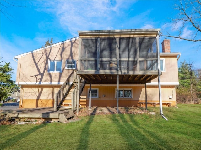 1 Thornbrook Ln N, Suffern, NY 10901 - back of property featuring a sunroom, a chimney, a lawn, and stairway