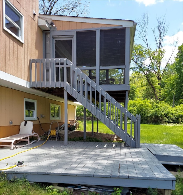 1 Thornbrook Ln N, Suffern, NY 10901 - rear view of house featuring a sunroom, a deck, stairway, and a lawn