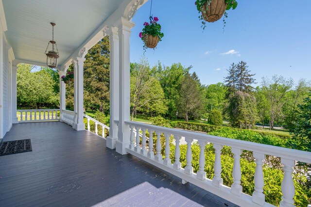 381 W Neck Rd, Lloyd Harbor, NY 11743 - wooden terrace with a porch and view of scattered trees