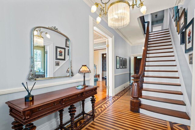 381 W Neck Rd, Lloyd Harbor, NY 11743 - foyer entrance with a chandelier, stairs, crown molding, and wood finished floors