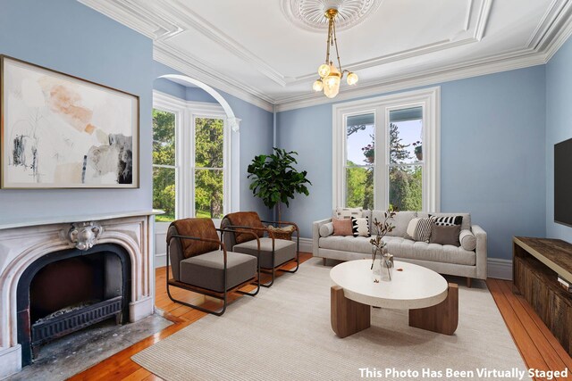 381 W Neck Rd, Lloyd Harbor, NY 11743 - living area with crown molding, a high end fireplace, wood finished floors, and a healthy amount of sunlight