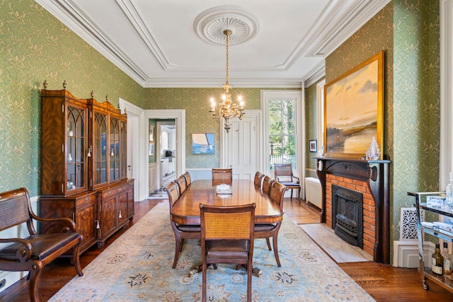 381 W Neck Rd, Lloyd Harbor, NY 11743 - dining space with wallpapered walls, a chandelier, radiator, and light wood-type flooring