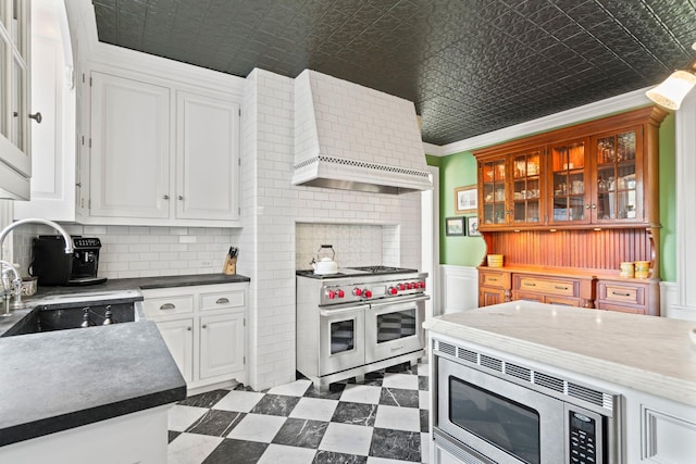 381 W Neck Rd, Lloyd Harbor, NY 11743 - kitchen featuring an ornate ceiling, appliances with stainless steel finishes, a sink, and wall chimney range hood