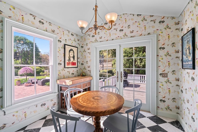 381 W Neck Rd, Lloyd Harbor, NY 11743 - dining space with a chandelier, french doors, wallpapered walls, light floors, and vaulted ceiling