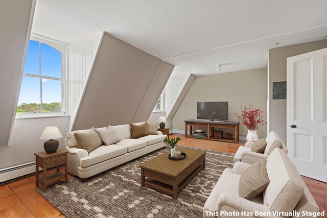 381 W Neck Rd, Lloyd Harbor, NY 11743 - living area featuring a baseboard radiator, wood finished floors, and a wealth of natural light
