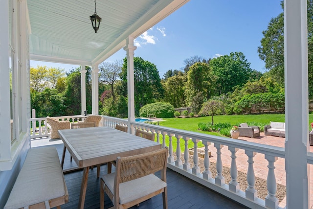 381 W Neck Rd, Lloyd Harbor, NY 11743 - balcony featuring view of scattered trees and outdoor dining space