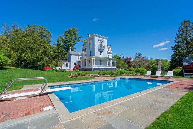 381 W Neck Rd, Lloyd Harbor, NY 11743 - swimming pool with a diving board, a lawn, and a patio