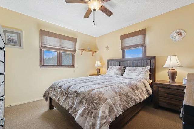 18 Hoppin Ave, Montauk, NY 11954 - carpeted bedroom with baseboards, a textured ceiling, and ceiling fan