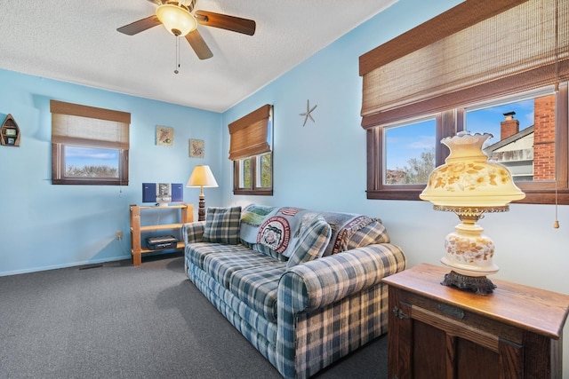 18 Hoppin Ave, Montauk, NY 11954 - carpeted living room with a ceiling fan, a textured ceiling, and baseboards