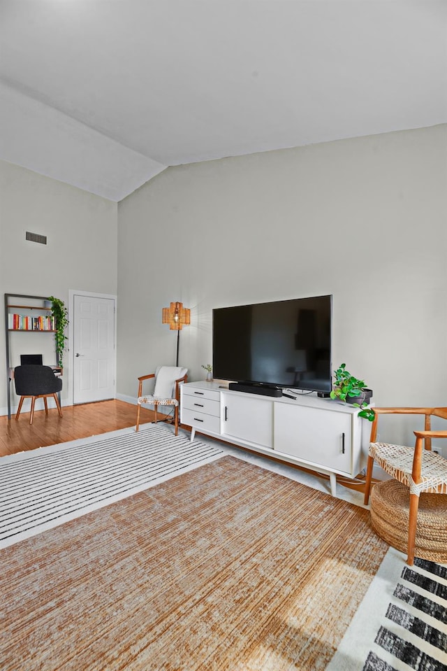 2 Angelas Pl Unit 2B, Bronx, NY 10465 - living room featuring baseboards, vaulted ceiling, wood finished floors, and visible vents