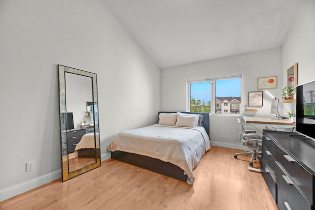 2 Angelas Pl Unit 2B, Bronx, NY 10465 - bedroom with baseboards, light wood-style flooring, and high vaulted ceiling