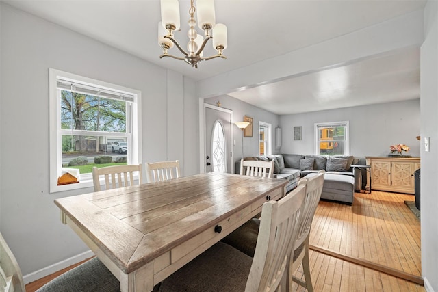 2 Random Rd, Greenwood Lake, NY 10925 - dining area with a chandelier, light wood finished floors, healthy amount of natural light, and baseboards